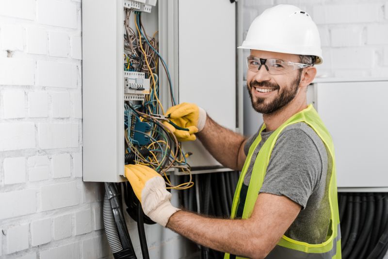 Electrician Working on Panel